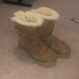 Tan Ugg boots with bows on the back